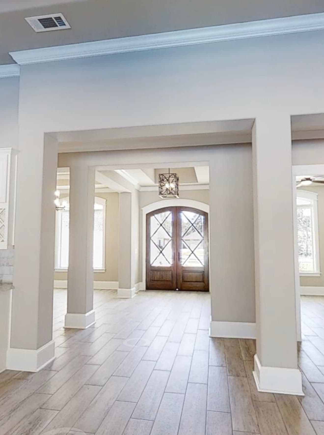 Open entry with archways and double front doors